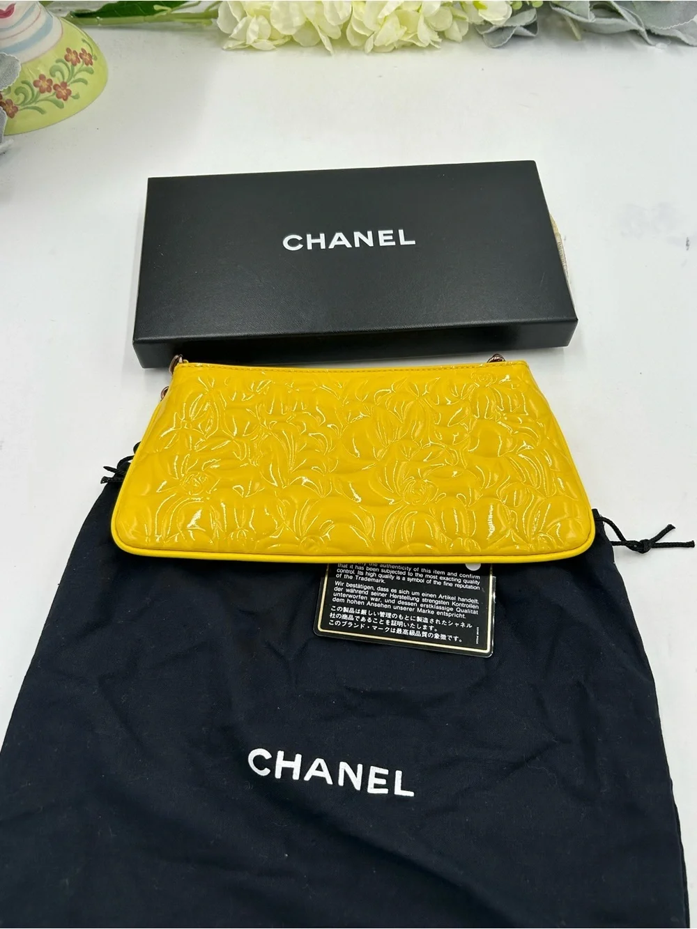 Women's Chanel patent leather floral embossed shoulder bag made in Italy